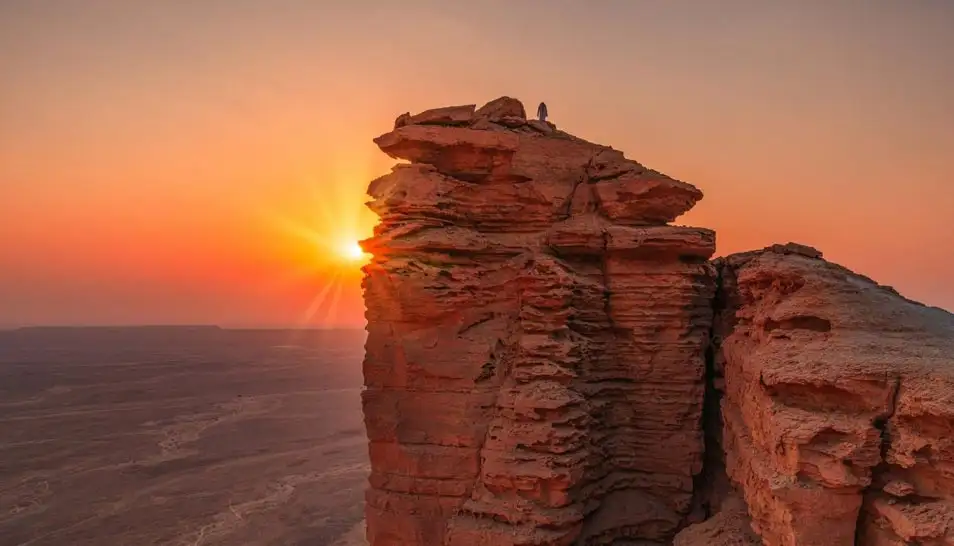 Sunset over desert cliffs at Edge of the World Riyadh